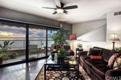 Living room with high ceiling, ocean vistas and sl