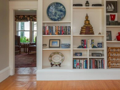 Custom built book shelves line the...