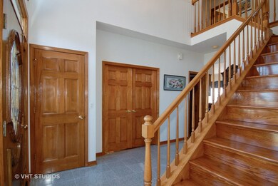 Fancy 2 Story entry with lots of hardwood that loo