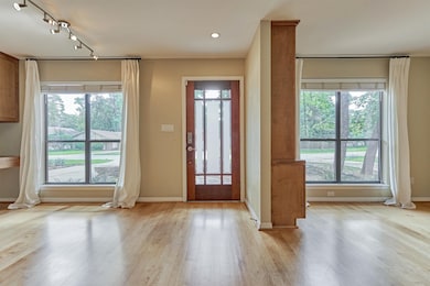 Front entry flanked by breakfast room and one of t