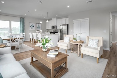 Living room with recessed lighting, light wood fin
