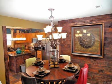 Dining room also features a lovely wood accent wal
