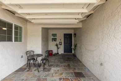 View of exterior entry with stucco siding