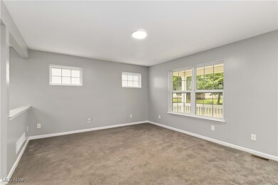 Spare room with carpet flooring and baseboards