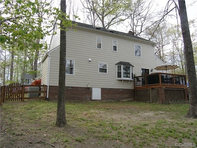 Rear View of 819 Watch Hill Road. Rear Fenced Backyard, Rear Deck with Lattice Underneath for Storage, Exterior of the House Painted 2017