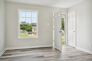 Entrance foyer featuring light hardwood / wood-sty