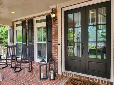 View Of Rocking Chair Front Porch & Double Doors