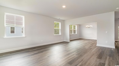 Spare room featuring dark wood-style flooring, vis