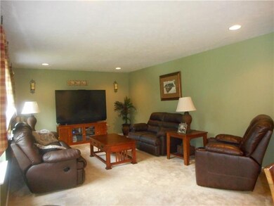 Living room with recessed lighting.