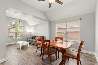 This photo features a bright, open dining and livi