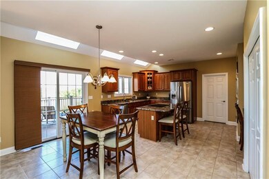 Eat-in kitchen with granite counters & skylights!