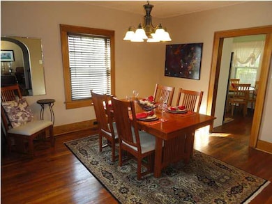 Large, open formal dining with original hardwood f