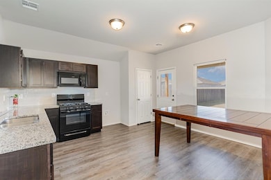 With large dining area that leads into the patio/backyard