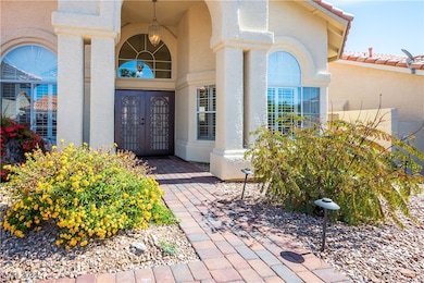 Entrance to property with french doors, stucco sid