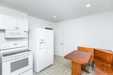 Kitchen with eat in area.