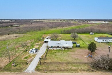 Birds eye view of property with a rural view