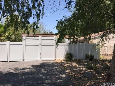 The entire yard has newer vinyl fencing and gate t