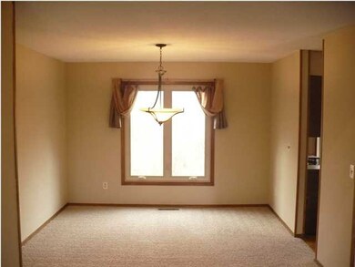 FORMAL DINING ROOM WITH NEW LIGHT FIXTURES.