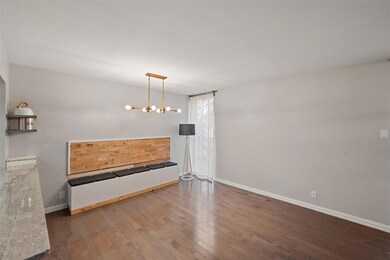 Unfurnished dining area with hardwood / wood-style