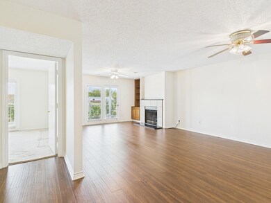 Unfurnished living room featuring dark wood-style 