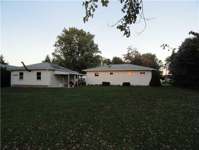 Exterior Back. Roof is being replaced on home and 