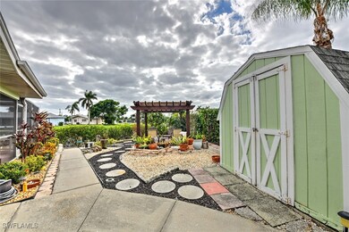 View of patio with a storage shed