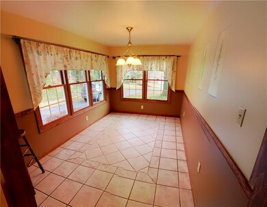 Breakfast Nook with two walls of windows to let in