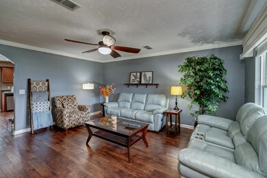 The large living room window allows for great natural light.