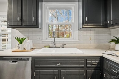 Kitchen featuring decorative backsplash, stainless