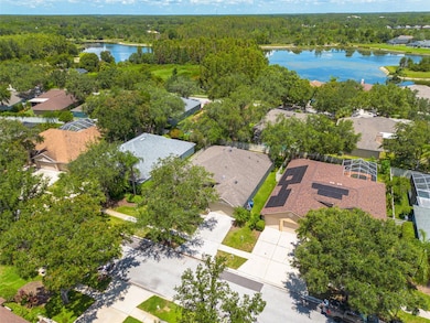 Discover your new home's prime location within the prestigious Hunter's Green community, beautifully nestled among mature oak trees and well-maintained neighborhoods. This aerial perspective showcases the privacy and tranquility that makes this location so desirable.