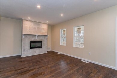 Beautiful tiled fire place with new flooring and n