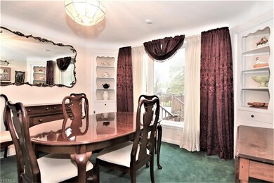 Another view of Dining Room showing wall mirror wh
