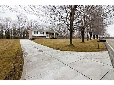 Exterior Front. Newer concrete driveway, pad and s