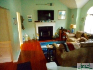 Living room with hardwood floors, fireplace and va