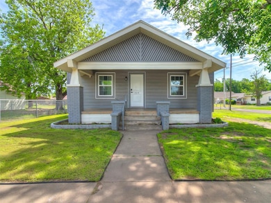 View of front of property with brick siding and co