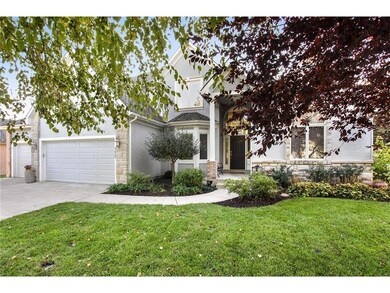 Home is surrounded by lovely landscaping