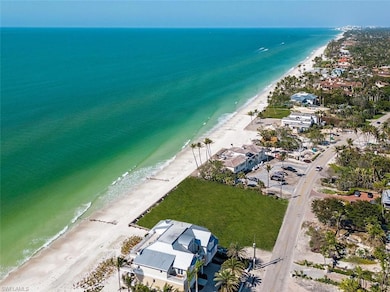 Bird's eye view with a water view and a view of th