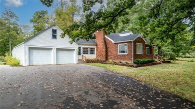Large driveway and attached garage