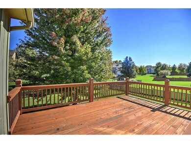 large deck off kitchen walks down to east facing b