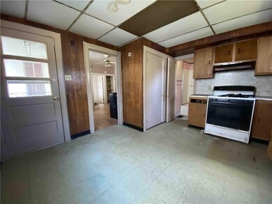 1st fl kitchen (looking at side porch door and livingroom)