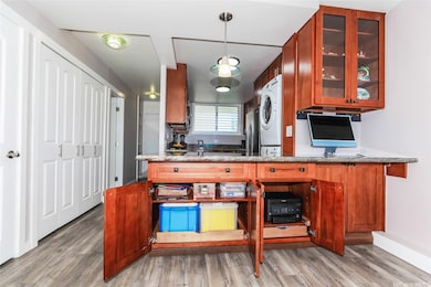 Built-ins and pull-outs make this a perfect home office space.