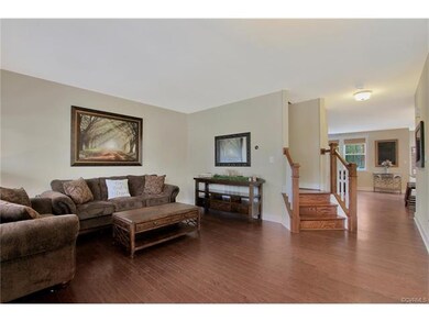 Formal living room with hardwood floors throughout