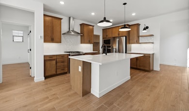 Kitchen with pendant lights & center island