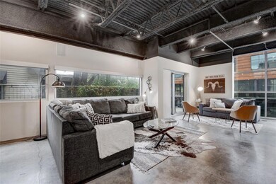Living room featuring concrete floors and a high 