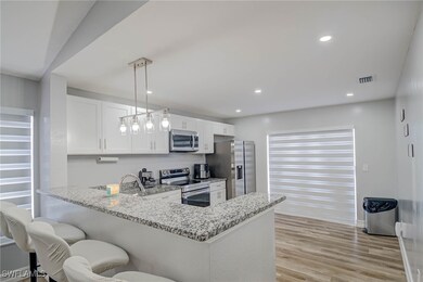 Kitchen featuring appliances with stainless steel