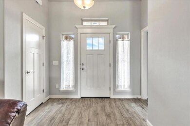 Entryway featuring light wood finished floors and baseboards