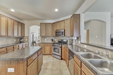 The fantastic Island kitchen features a gas cooktop, stainless steel appliances, a large breakfast bar and lots of counter space!