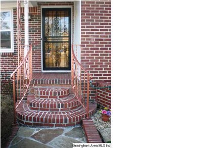 Front door showing flagstone path and brick steps