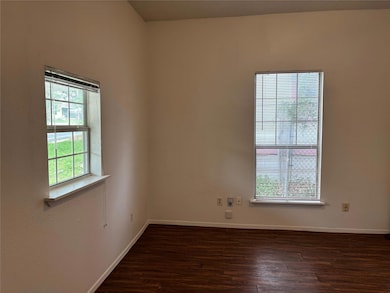 Unfurnished room featuring wood finished floors a