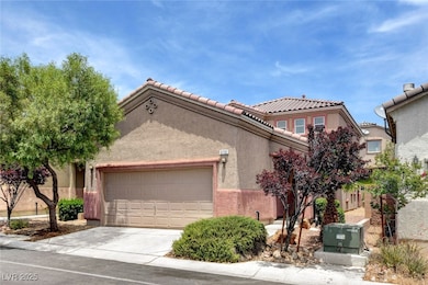 Mediterranean / spanish home with an attached gara